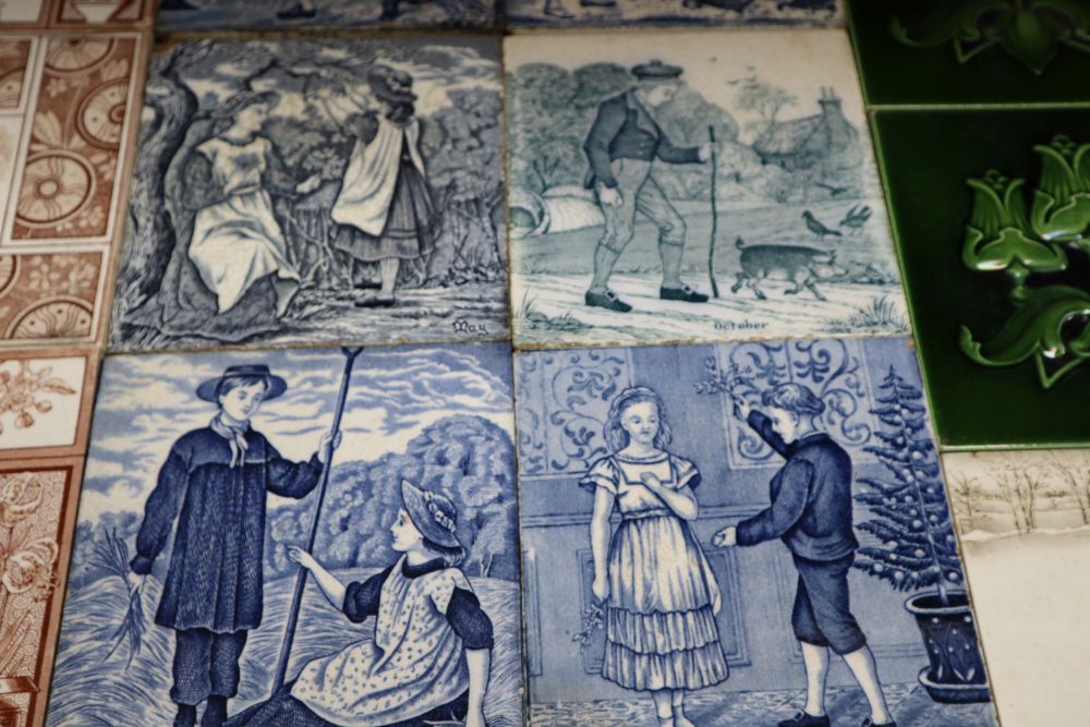 A collection of 19th/early 20th century transfer-printed and moulded wall tiles,